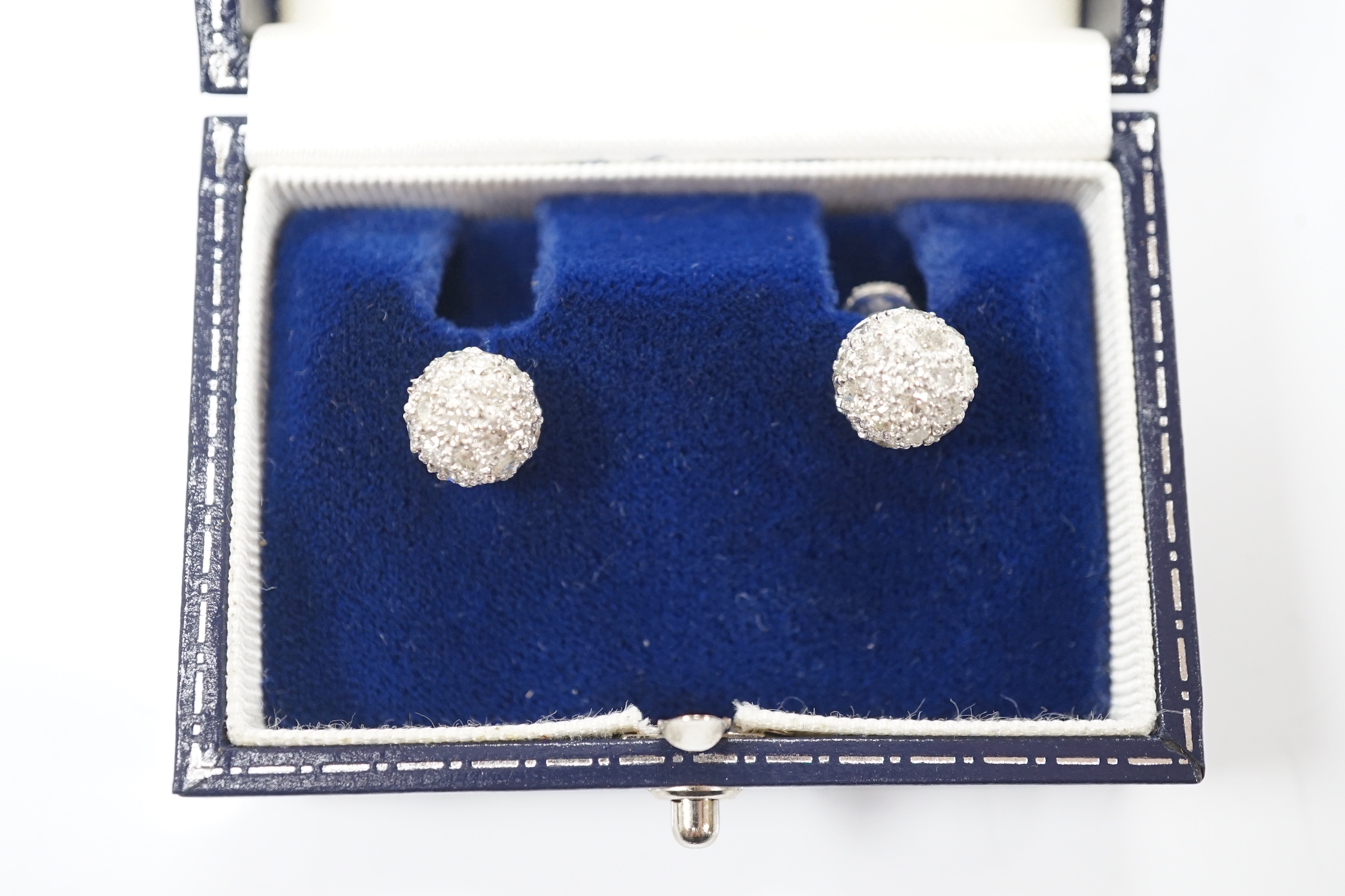 A modern pair of 18k white metal and pave set diamond spherical earrings, 9mm, gross 6.2 grams.